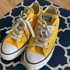 Yellow converse tennis shoes